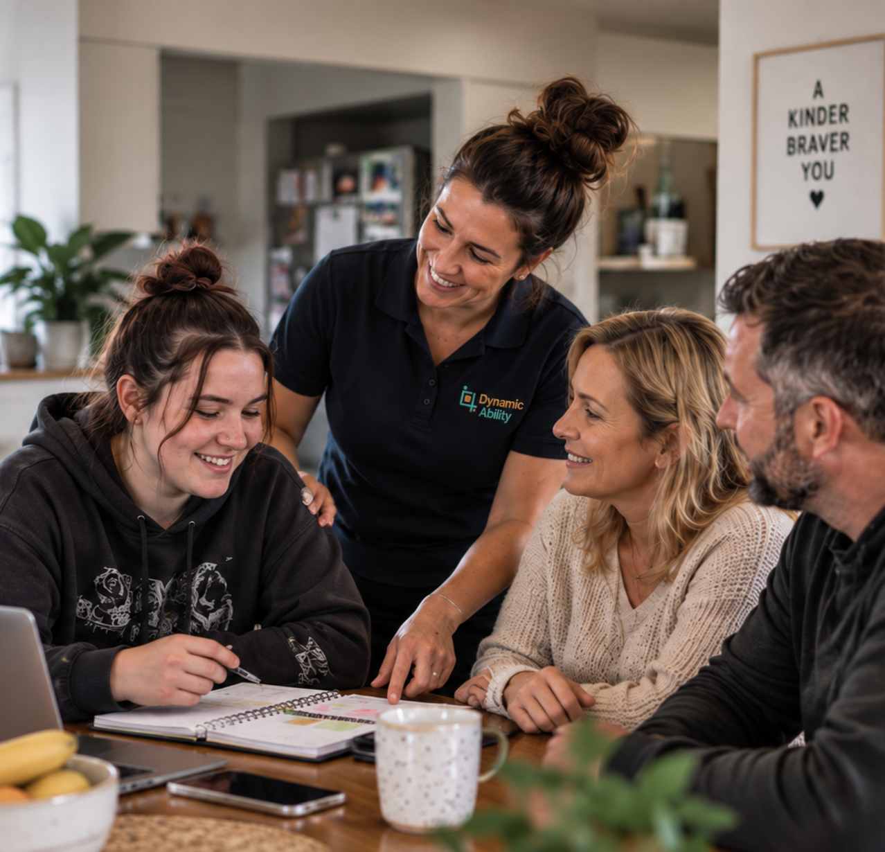 A Dynamic Ability practitioner working with a young adult participant and her family to put support into practice at home